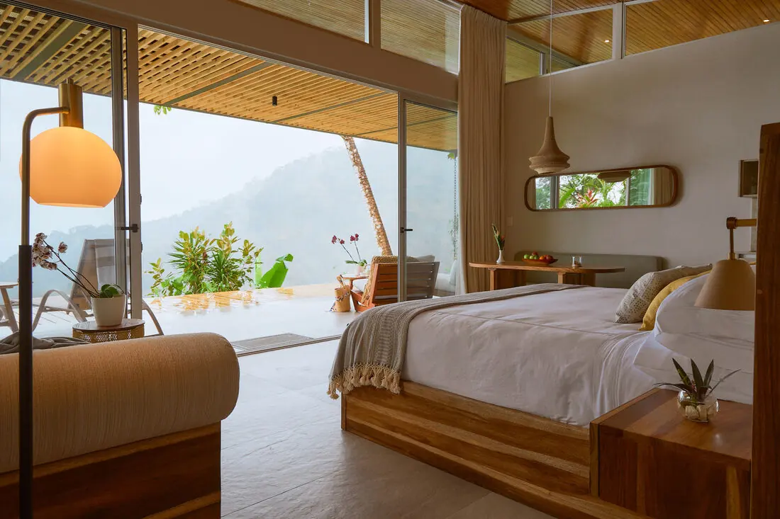 Ocean View Villa bedroom opening to the deck and jungle view