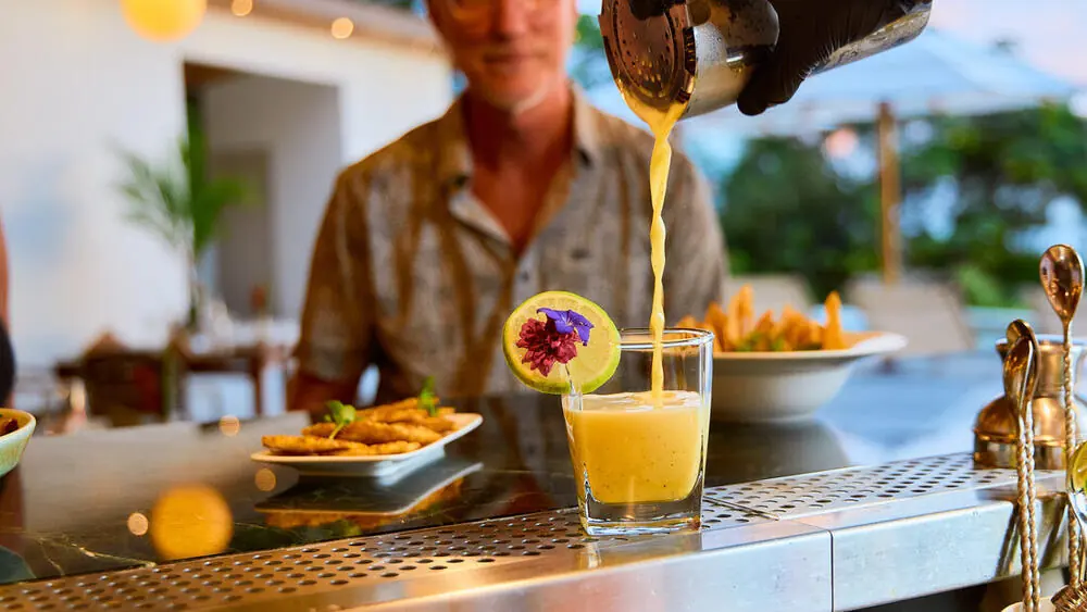 Bartender pouring a fresh cocktail